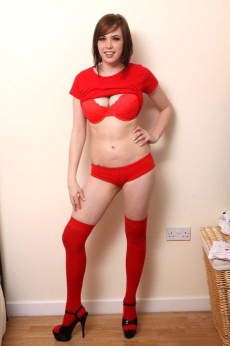 Irresistible teen Louisa wears sexy red stockings while showing her big tits