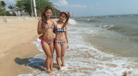 Delicious teenage Thai babes Bee and Miaw posing at the beach in hot bikinis