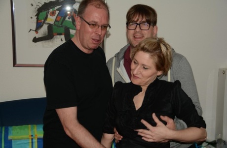 Teresa R, a mature blonde German amateur, was caught on camera creaming during anal threesome.