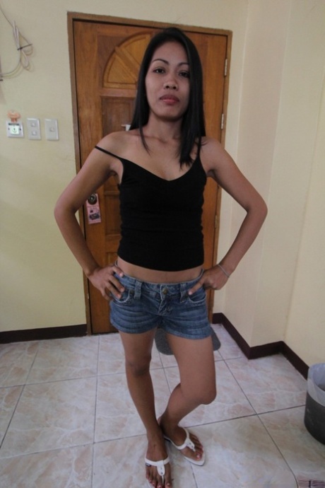 Slim Filipina girl doffs denim shorts to make her nude modelling debut