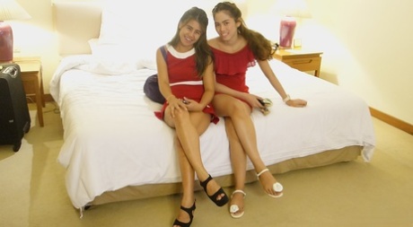 The cute girl from Thailand models her red dress before heading out for the streets as a first timer.