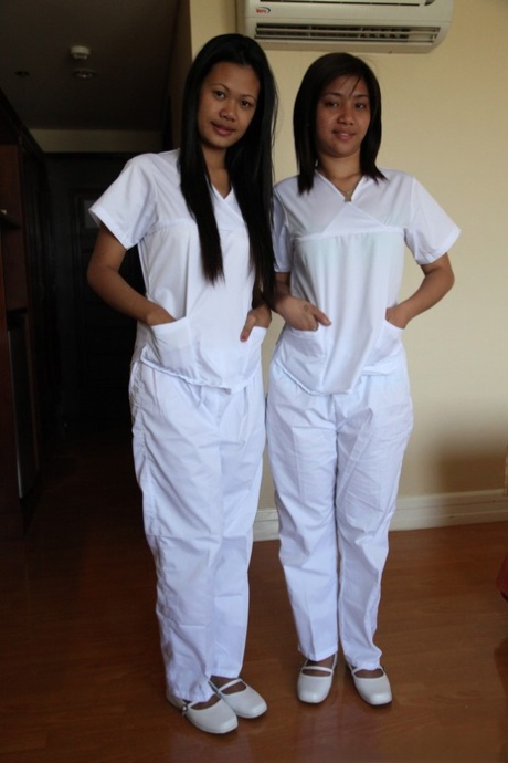 Pose: Nurses Joanna (left) and Joy (right) are posing on the bed wearing white uniforms, with their lusty Filipino counterparts.