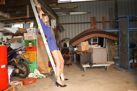 Irena, a blonde amateur, was gagged and tied up to a ladder in her own clothes for a garage grope.