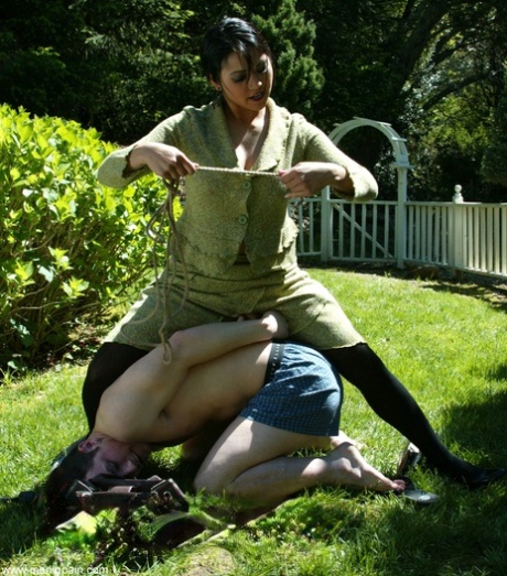 Dominant Asian Lady Gags A White Man With Her Pantyhose On Back Lawn