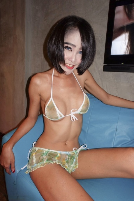 See ladyboy Wawa engage in a variety of cowgirl activities, including playing with her ass and cock.