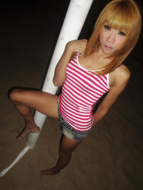 She shows Nan a skinny blonde ladyboy with high heels who has nice legs and buttocks.