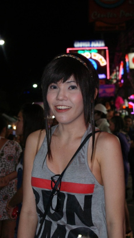 Young Ladyboy Hookers From Thailand Are Smiling On Camera Waiting For Clients