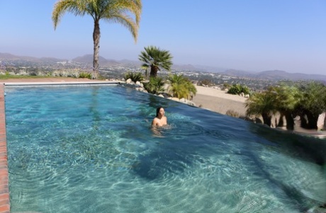 Gorgeous brunette teen Abella Danger showing her naked body by the pool