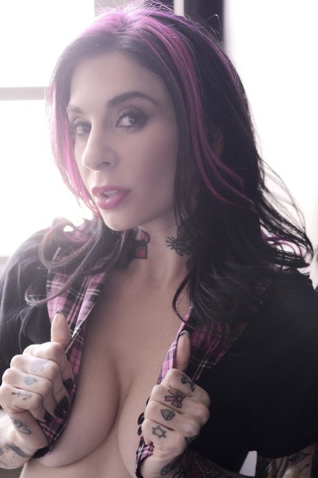 Well-known alt pornstar and model Joanna Angel shows nude body by the window