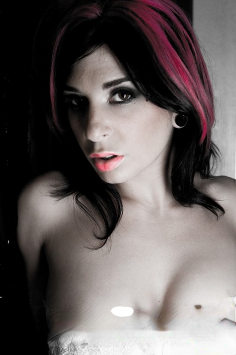 Erotic tattooed Joanna Angel in glove & white lace exposes her big breasts