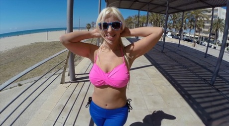 Stunning blonde Blondie Fesser flaunts her anus on the beach with confidence.