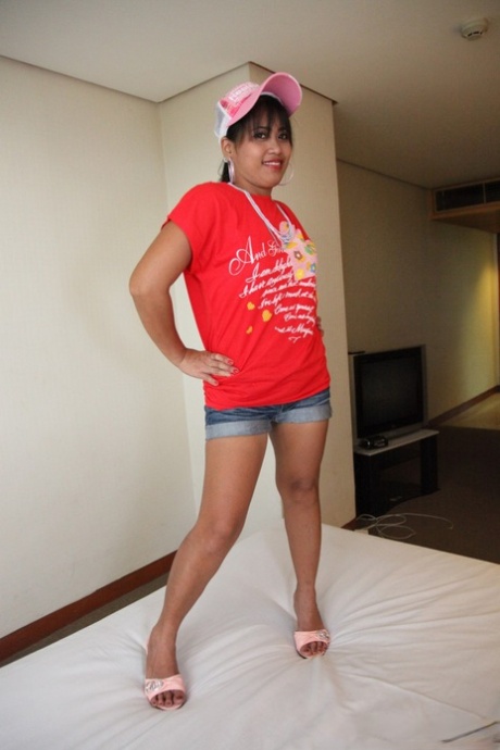 Sexy Filipina Charm demonstrates her delicious oral pleasure by wearing a red T-shirt.
