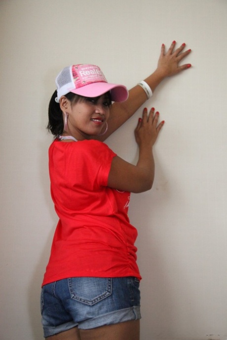 In a red t-shirt, Sexy Filipina Charm displays her mouth on the floor with gusto.