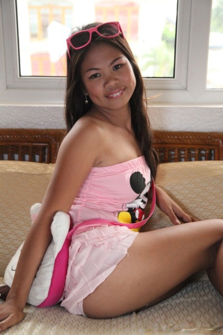 The lovely Filipina Nicole bares her cute legs and removes her dress.