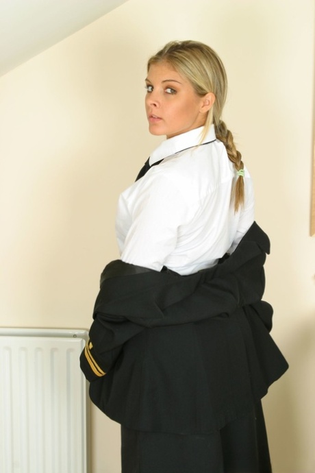 In provocative lingerie, seductress Naomi K is seen stripping off and mocking in the hot uniform.