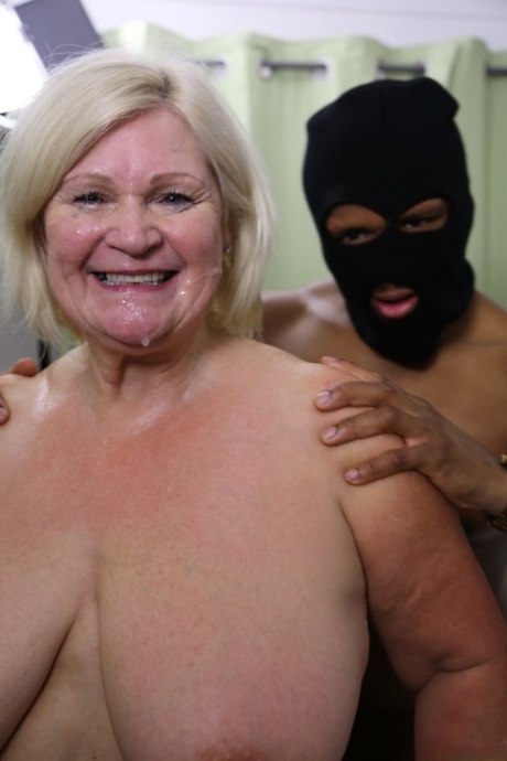 Granny Lacey Starr is subjected to blow-banging and has her face covered in cum.
