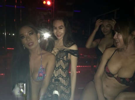 A multitude of attractive young women display their feminine features in candid club snapshots.