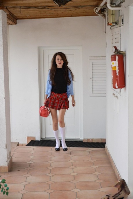 Schoolgirl smokes a cigarette prior to showing an old man her tight pussy