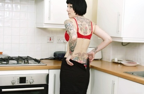 Tall Inked Goth Peels In The Kitchen To Flaunt Her Tats & Pussy On The Counter