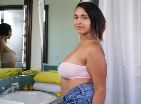 An Emori Pleezer, who is Latina and has big natural tits, blows her pussy in the bathroom.