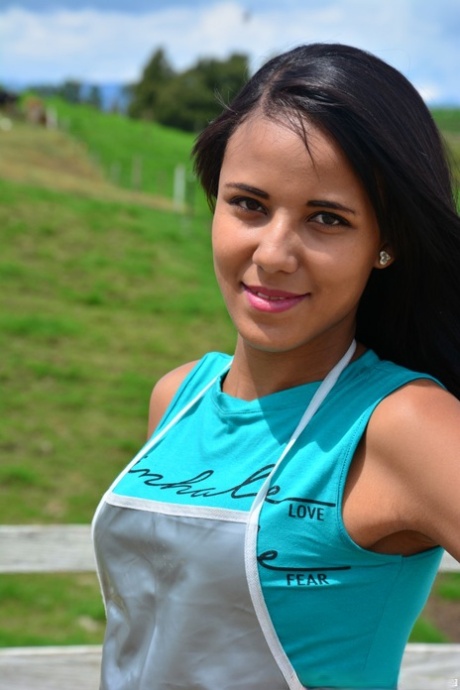 During lunch, the Latina farm girl with long hair and black eyes teases with her ass while having lunch.