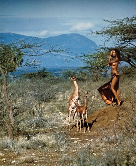The Somali woman known as Iman displays her sexy small breasts in Africa.