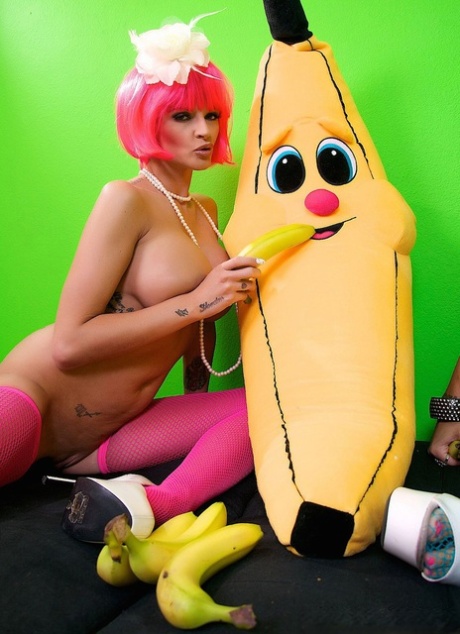 Bananas are inserted into the pussies of busty lesbians who wear fishnets and then eaten as food.