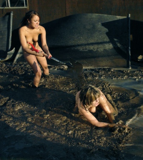 In the mud, MILF Tyla Wynn, a beautiful blonde, participates in a 2 against 1 naked lezdom session.