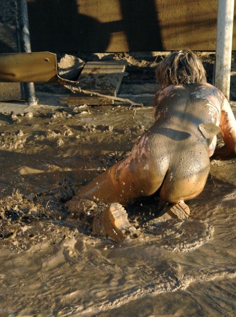 Tyla Wynn, a gorgeous blonde, experiences a 2 against 1 naked lezdom session in the mud.