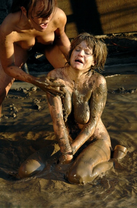 Blonde MILF Tyla Wynn endures a 2 against 1 naked lezdom session in the mud