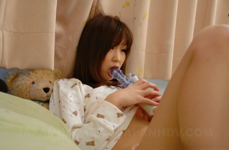 Horny Asian babe Shino Tanaka strips & masturbates with her favorite vibrator