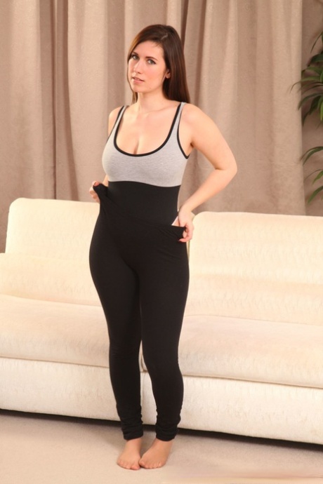 Victoria S showcases her oversized tits and attires herself in shiny nylon pants.