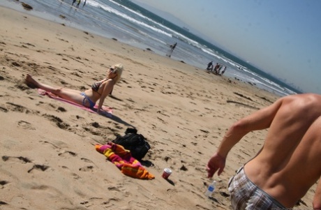 Biker girl Siri flaunts her big tits in a bikini on the beach: she's not hot but she's.