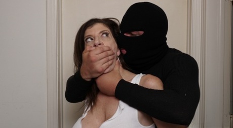 The massive MILF Sara Jay is attacked and flung by an unknown masked theftor, who hears her screaming.