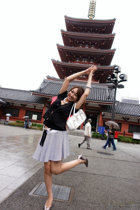 In public, Ryo Akanishi, a charming woman from Japan, displays her lovely panties.