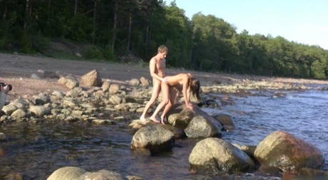 Katrina, the Naughty Teenager, delights in performing doggystyle sex on the beach.