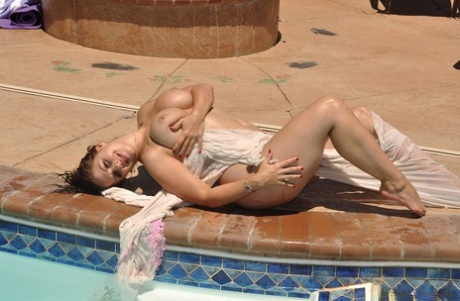 Shapely Brunette Eva Disrobes To Show Her Big Tits & Ass By The Pool