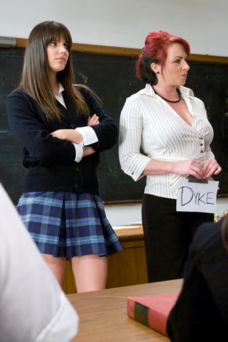 An attractive schoolgirl is spanked by a redheaded teacher with big tits, as seen in the scene where Princess Dolore.