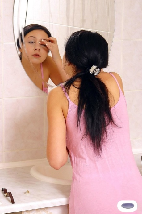 Comely MILF Belinda Displays Her Bald Pussy After Shaving In The Bathroom
