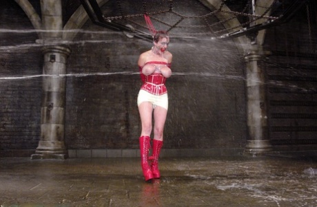 With her big tits exposed, MILF Mz Berlin participated in a water play session as part of BDSM.
