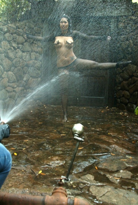 Intricate outdoor bondage with water, a slain woman dressed in black pantyhose named DragonLily endures.