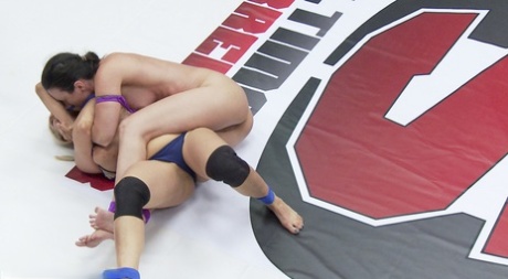 As part of a threesome, lesbian wrestlers expose their individual vaginal wound and finger each other's holes with their strips.