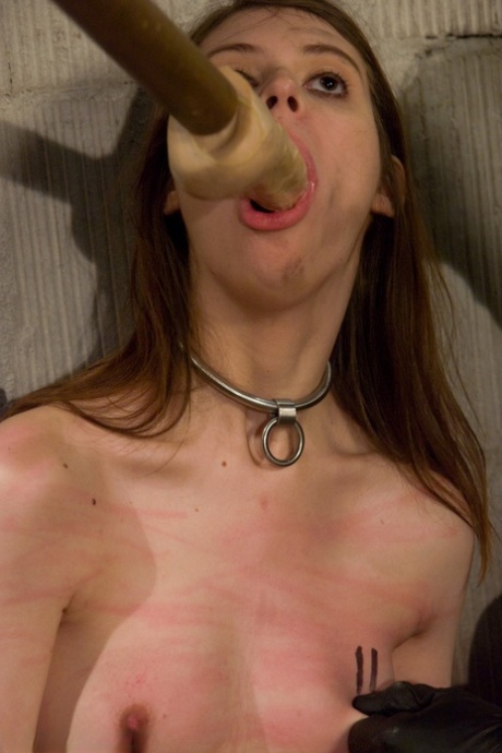 Naughty submissive Kristine fills her holes with toys during BDSM action.