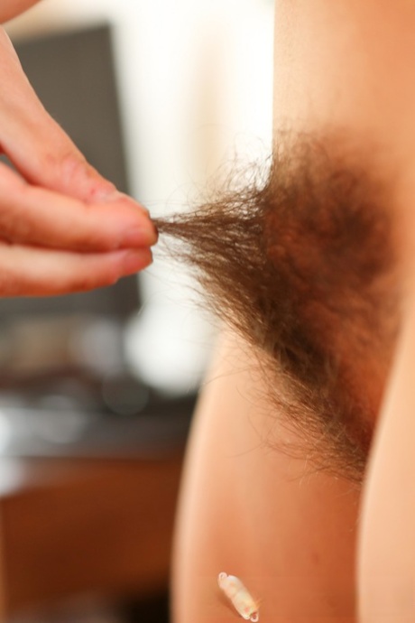 As an amateur brunette with big tits, Nora displays her passion by passionately wiping out the bushy nude curls.