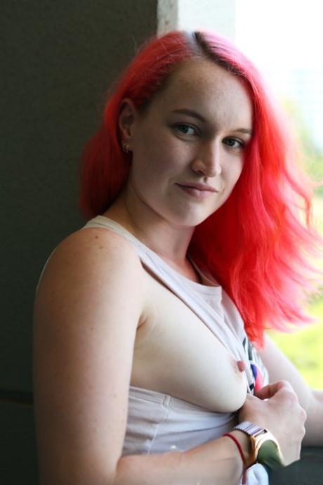 Australian doll with pink hair, Sierra Knight strips and displays her hot curves on the balcony.