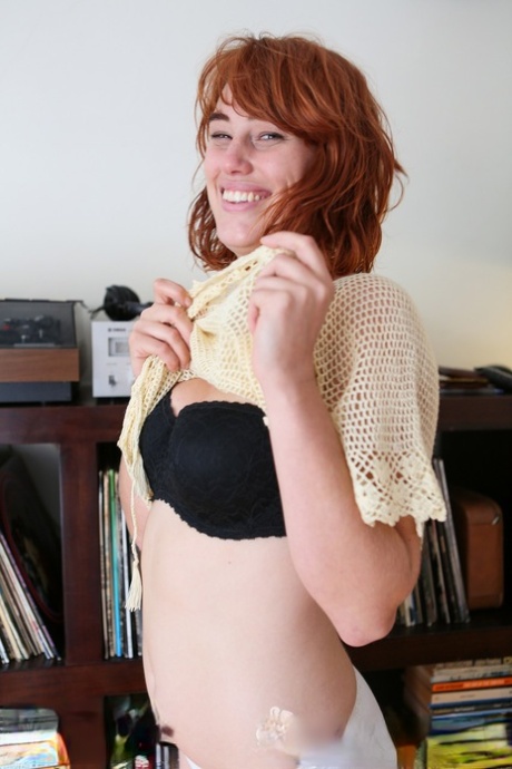 Pale redhead Molly Broad strips by the bookcase to flaunt her hairy muff Amateur naked video pics #7