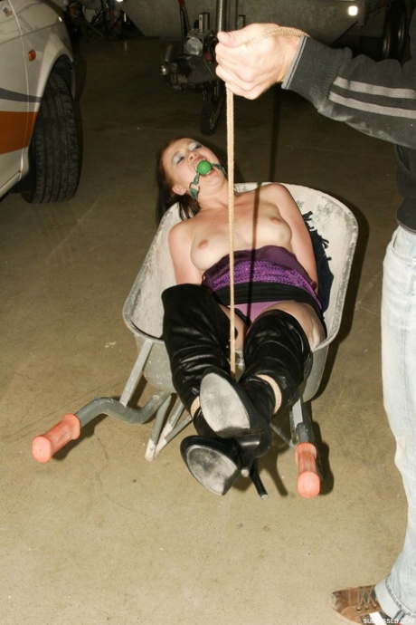 The amusement sex worker, Emma is subjected to being bound by her hands, ball-gagged with rubbery mats, and humiliated by a pervert.