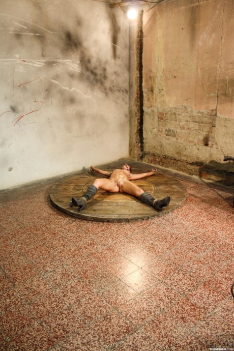 While being bound and ball-gagged, Jenny, an amateur slut, gets toyed with in her leather boots.