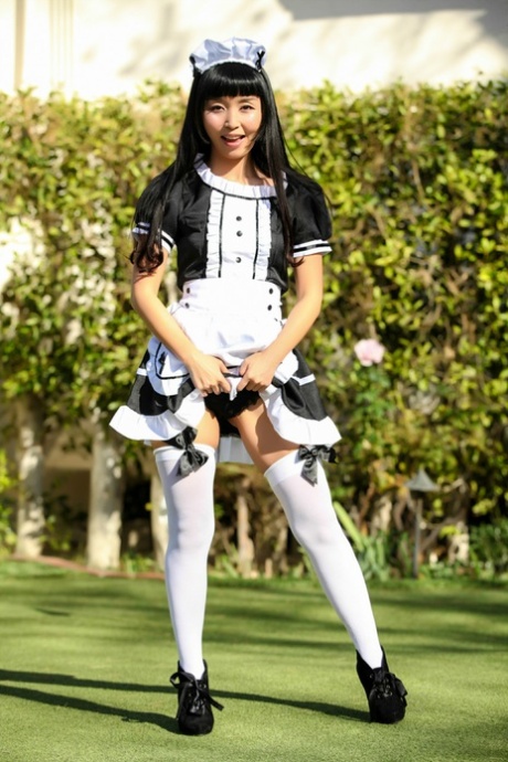Marica Hase, an Asian maid who is dressed in uniform but still enjoying her muff moments outside, shows off her fine hair by flaunting her uniform.