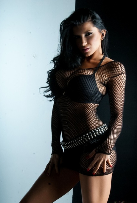 Big Boobed Pornstar Romi Rain Posing Seductively In Her Black Fishnets